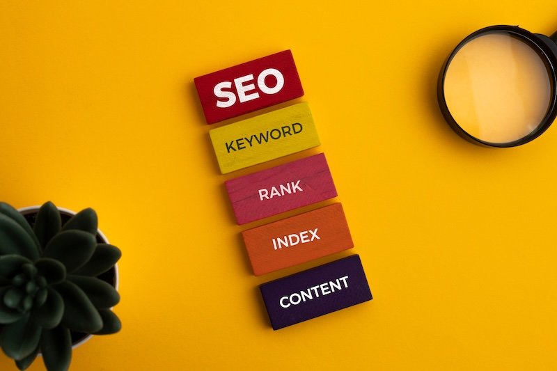 Search Engine Optimization concept. Blocks with words SEO, keyword, rank, index, content. Set of techniques and strategies aimed at improving the visibility of a website in search engine results
