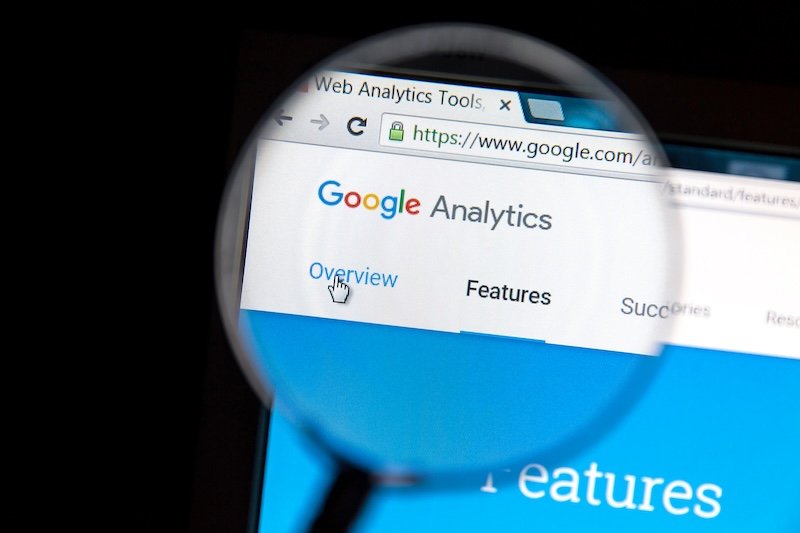 Ostersund, Sweden - May 23, 2016: Google Analytics website under a magnifying glass. Google Analytics is a web analytics service offered by Google