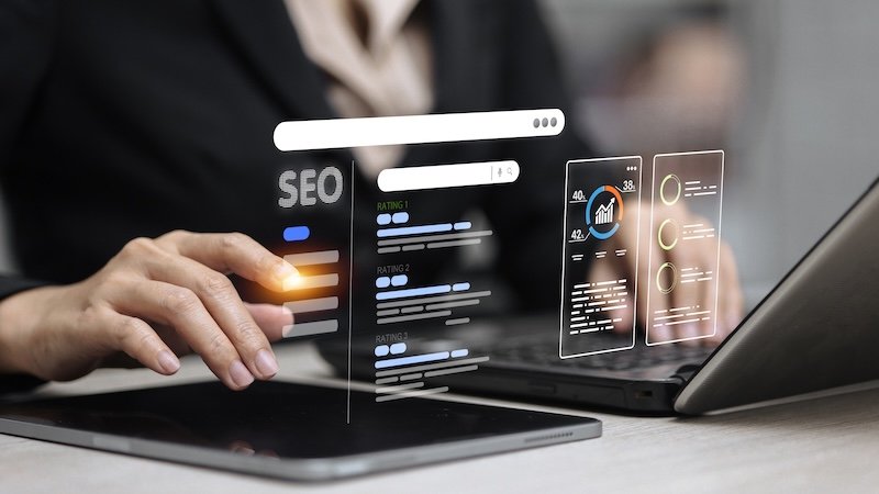 Businessperson analyzing SEO dashboard with search bar, keyword rankings, data charts and optimization analytics.
