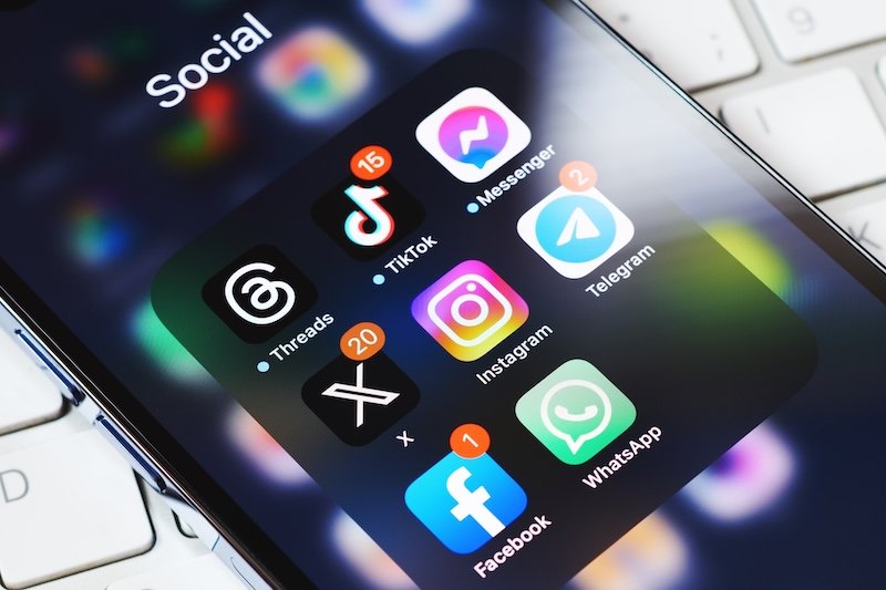 Moscow, Russia, 29-07-2023: New Elon Musk's twitter X app on smartphone screen surrounded by other social media network apps. Twitter rebranding. Modern social media communication.