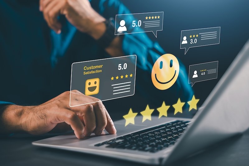 Customer review feedback rating system online satisfaction evaluation monitors digital marketing brand reputation and service quality using laptop with gold stars for better user experience. OriginalFilename: 25690114-_AAG3470.JPG